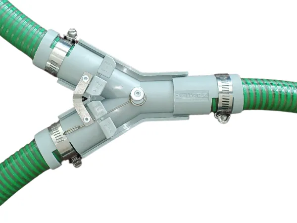 Grey MultiCrop Valve installed on green air seeder hoses